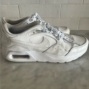 White Nike sneakers with star laces​​
